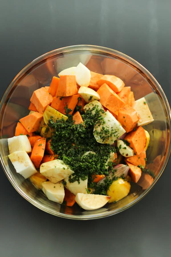 bowl with chopped root vegetables and thyme on top
