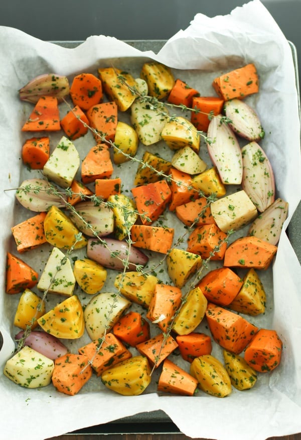 An overhead image of a sheet pan of roasted root vegetable.