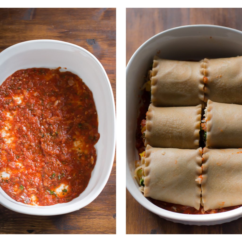 vegetable lasagna roll-ups placed in a baking dish with sauce on the bottom