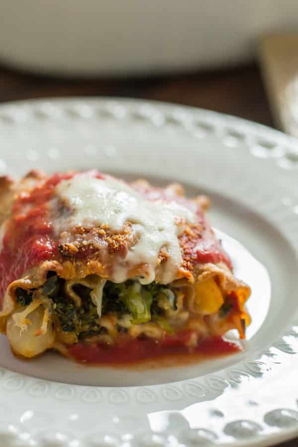 close up of a serving of vegetable lasagna roll-ups