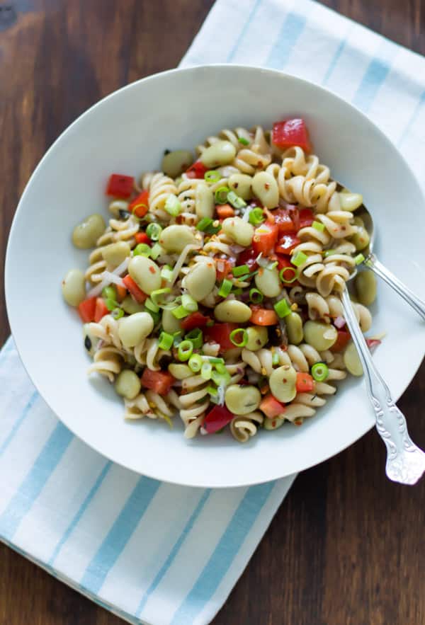 bowl of pasta salad with lima beans, anchovies, red pepper, red peppers, red onions, scallions, with thyme