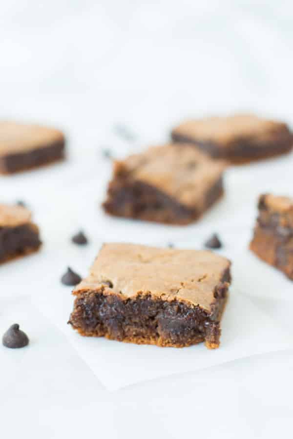 Flourless Chocolate Chip Brownies on parchment 