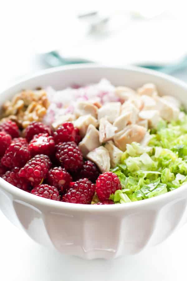 close up of Chopped Salad with Tayberries in a white bowl