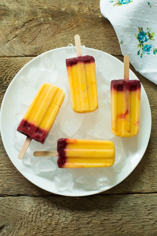 Four Mango Plum Popsicle on a serving plate