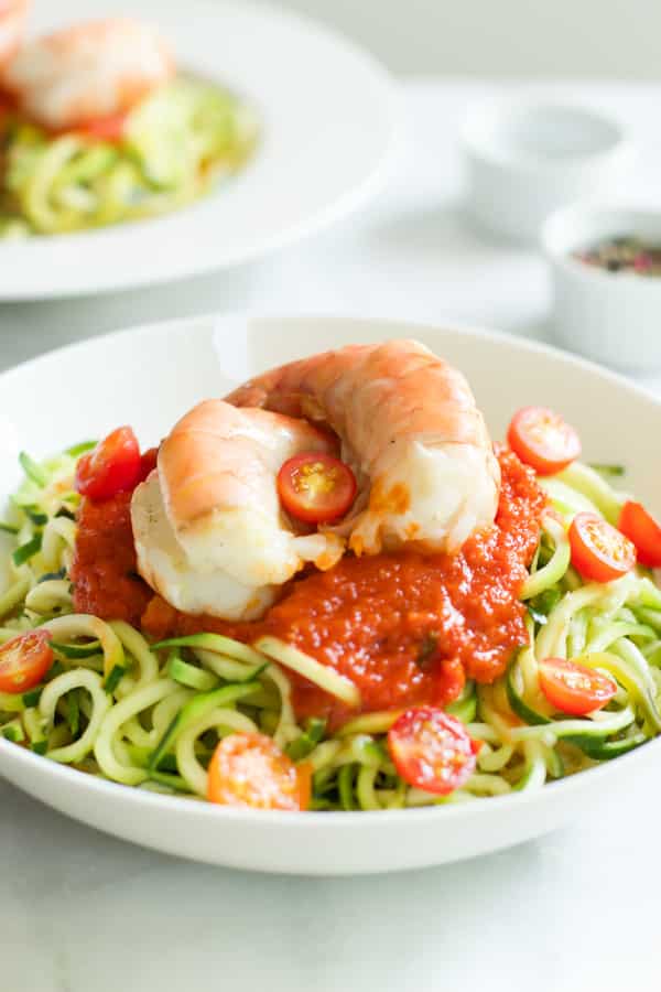 Zucchini noodles with tomato sauce and shrimp.