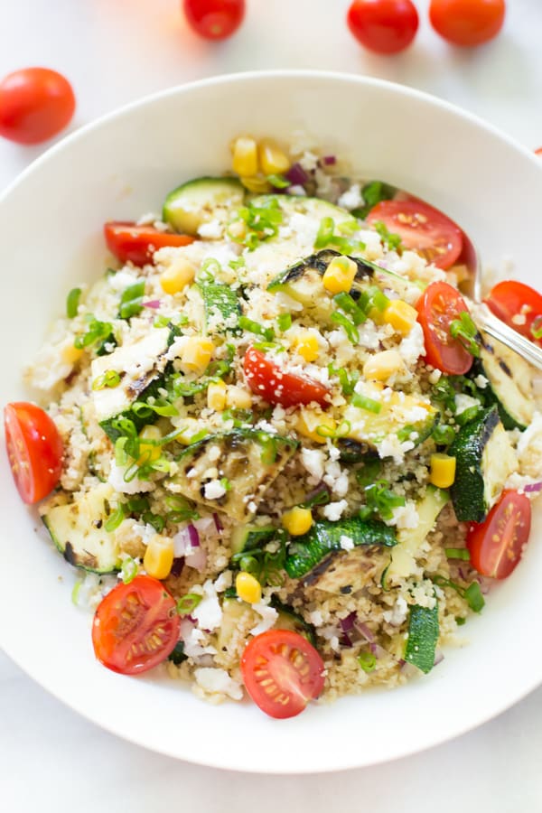 Close up on Zucchini Couscous Salad in a white bowl