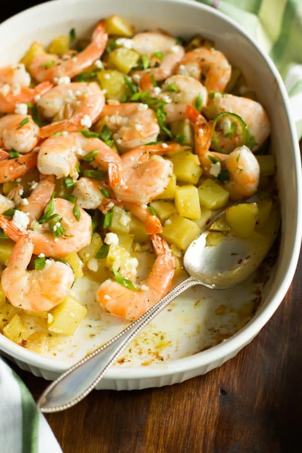 Roasted Potato with lemon shrimp in a baking dish.