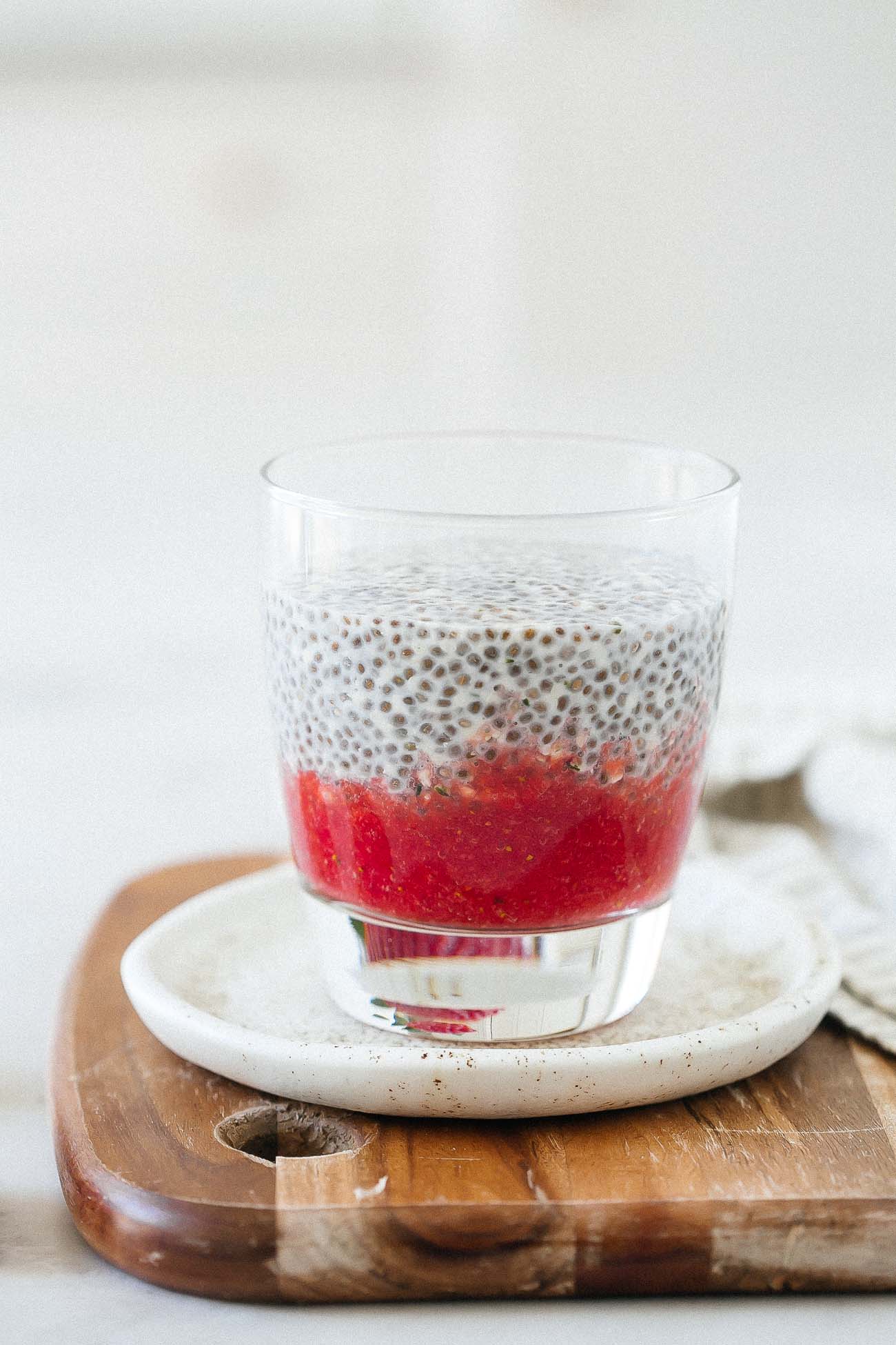 Glass with pureed strawberry and chia pudding
