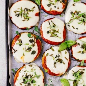 overhead view of eggplant pizza on a baking sheet