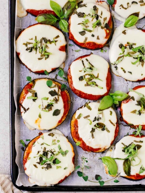 overhead view of eggplant pizza on a baking sheet