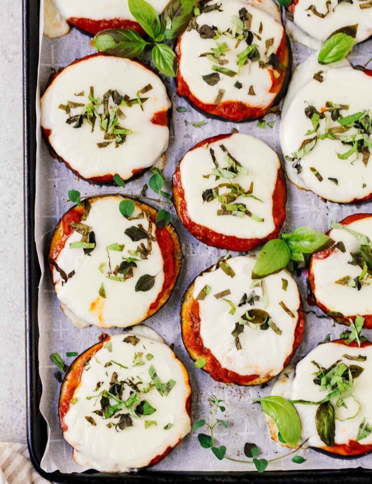 overhead view of eggplant pizza on a baking sheet