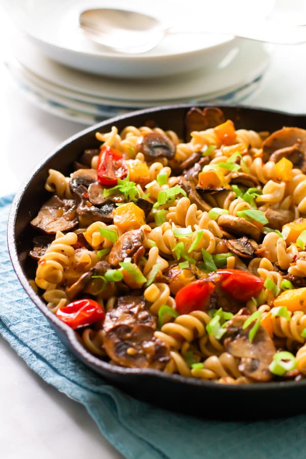 Fusilli with mushroom and roasted butternut squash in a cast iron.