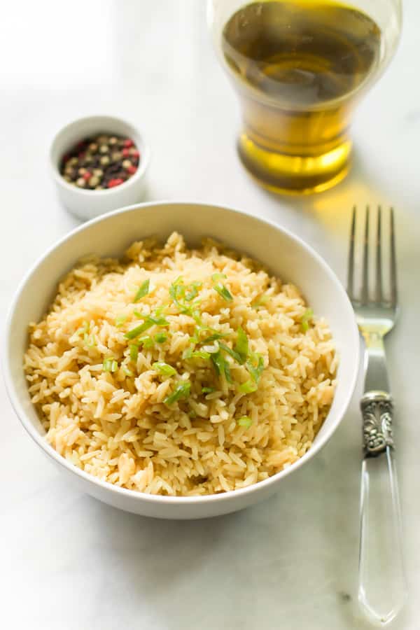 fluffy rice in a bowl with a fork beside it