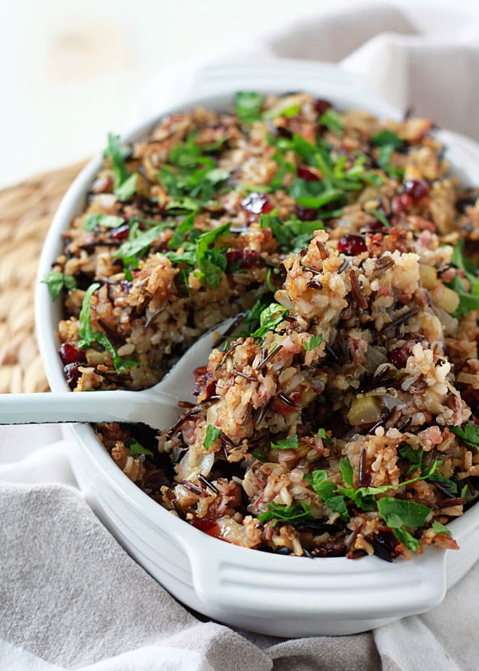 A white dish with herbed wild rice and quinoa stuffing.