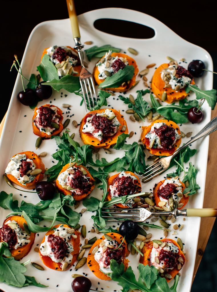 A white serving tray of sweet potato with smokey eggplant dip cherry chutney.