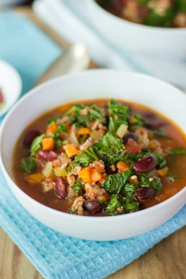 Close up image of a bowl of extra-lean turkey chill with kale.