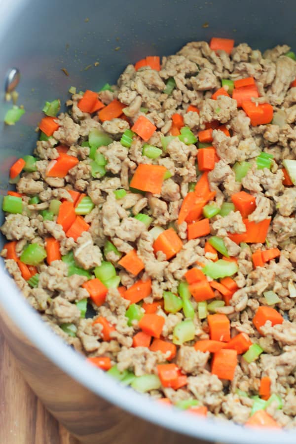 A pan with the ground turkey sauted with vegetables.