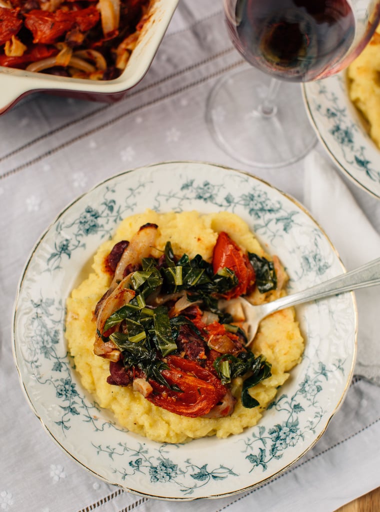 Polenta with Slow Roasted Tomatoes & Collard Greens Polenta with slow roasted tomatoes & collard greens in a plate.