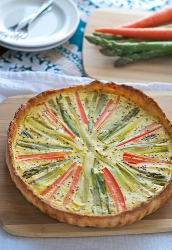 Sunburst spring vegetable quiche made with puff pastry crust.
