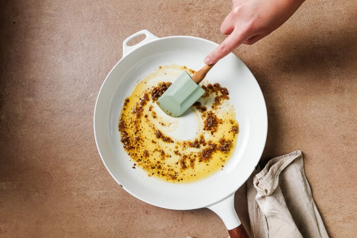 white skillet with olive oil