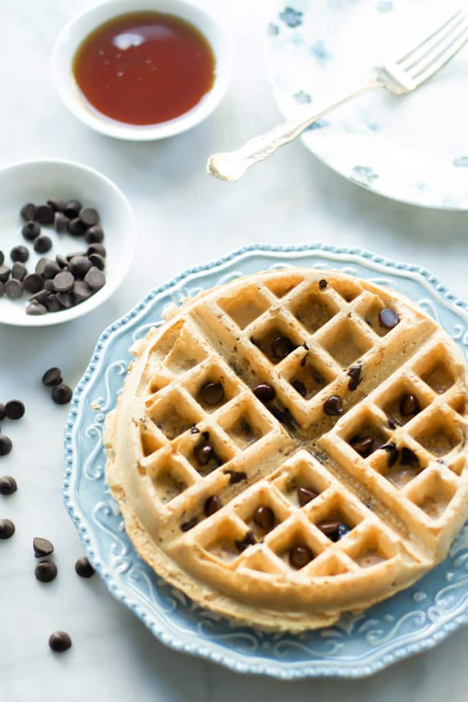 A serving of almond butter waffle on a blue plate.