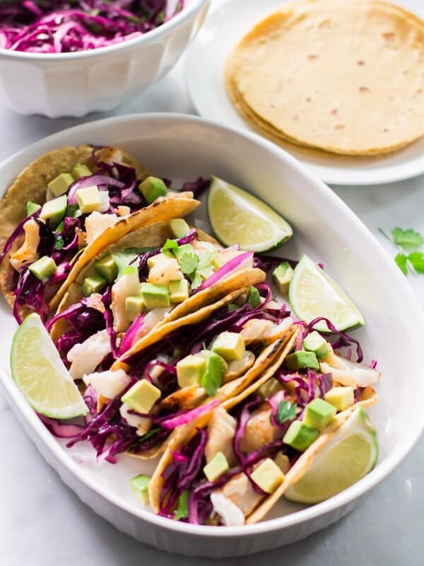 Overhead view of a platter containing Grilled Fish Tacos