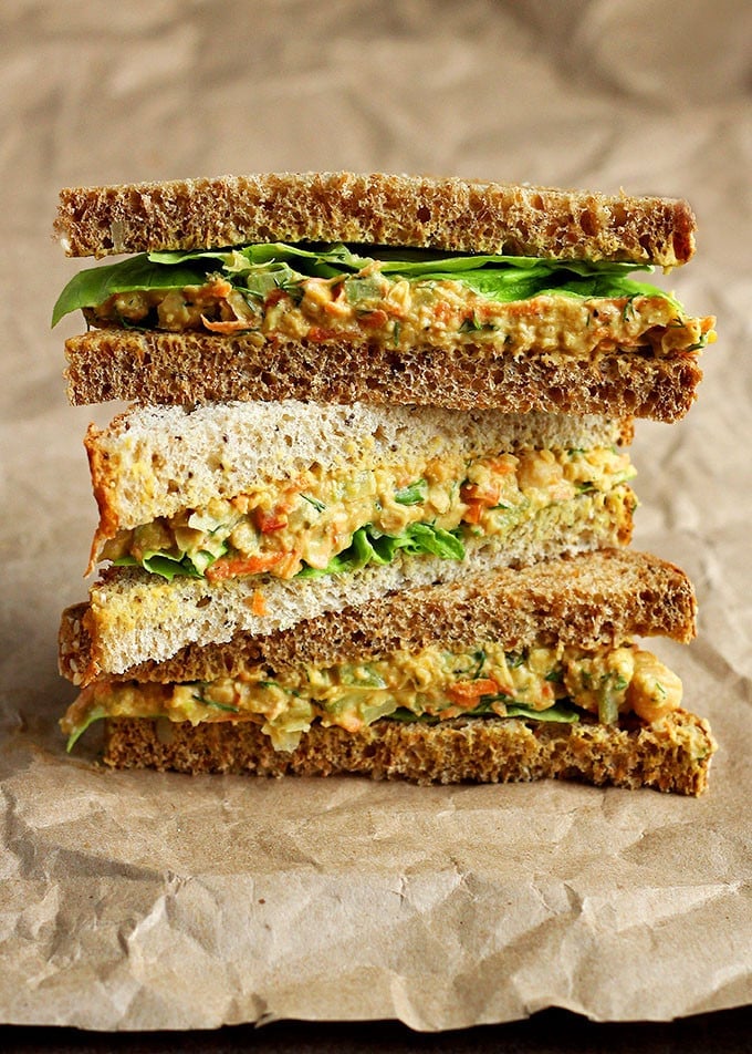 Three lentil chickpea sandwiches cut diagonally stacked on top of one another.