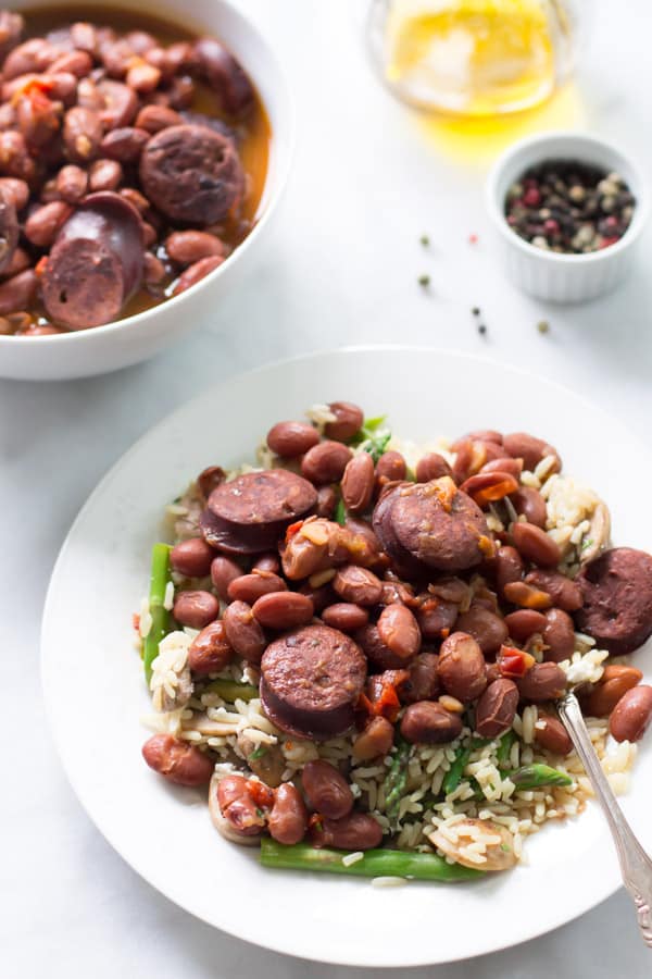 A plate of sausage and beans made in a pressure cooker.