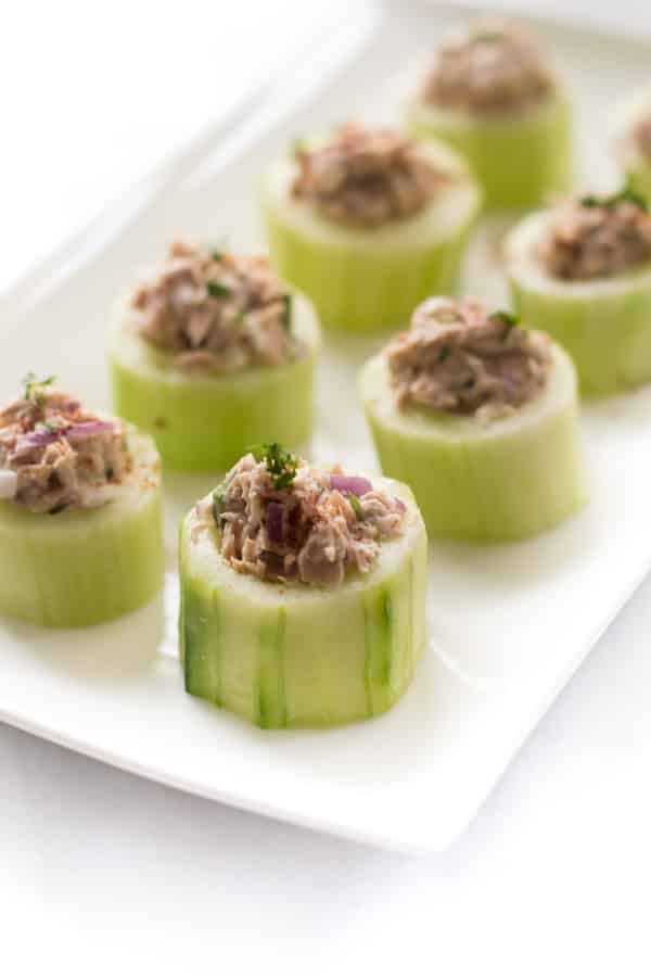 A platter of multiple tuna cucumber cups.