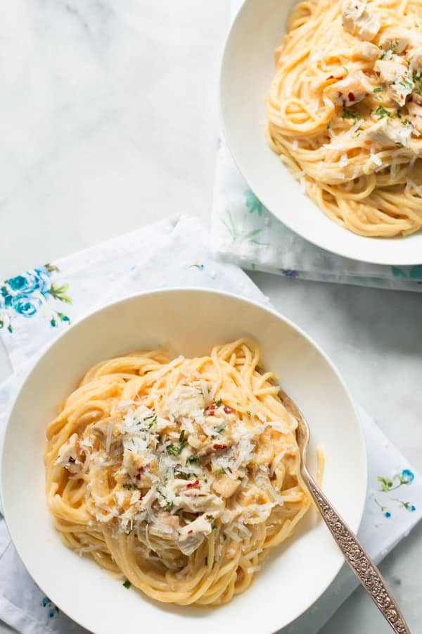 A bowl of pumpkin alfredo sauce pasta.