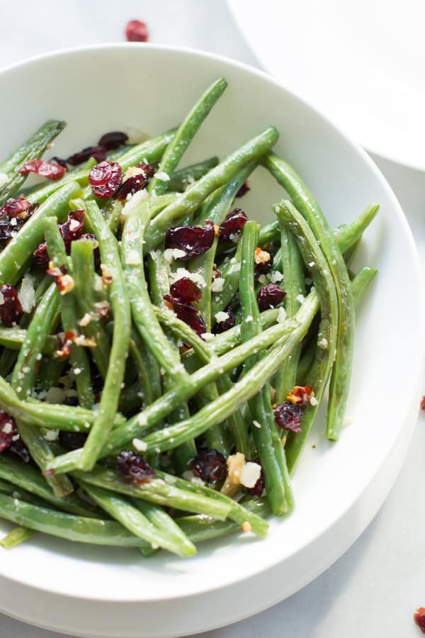 Close up of a bowl of roasted parmesan green beans.