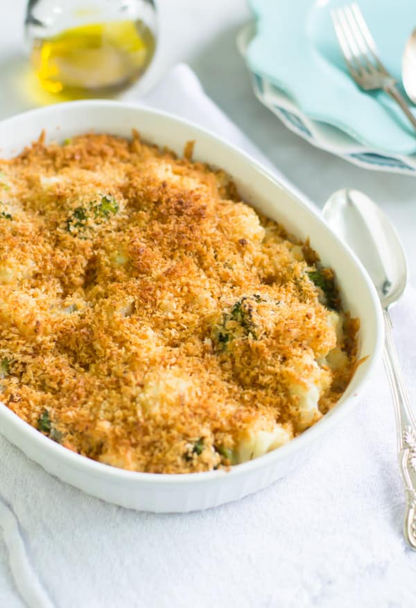 A casserole dish of cheesy broccoli cauliflower bake.