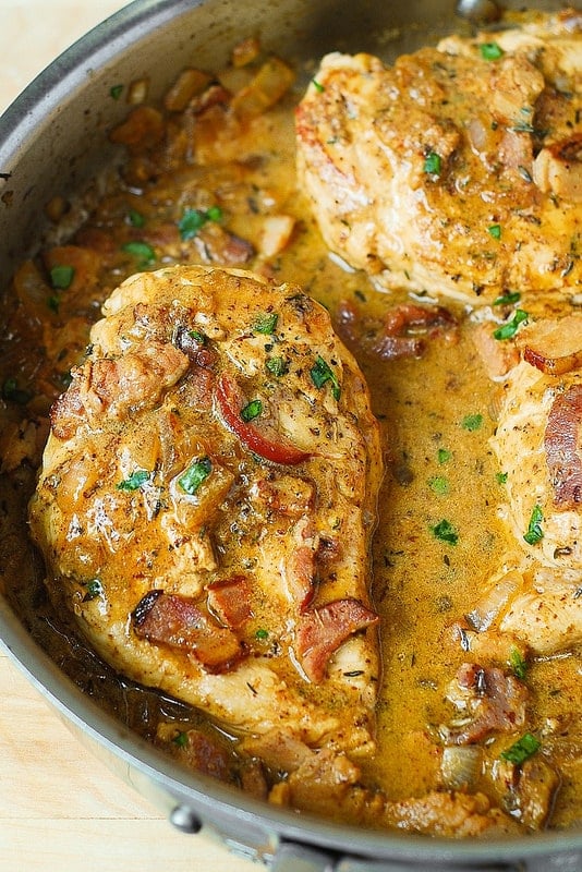 A closeup of Chicken with Bacon Mustard Sauce in a skillet