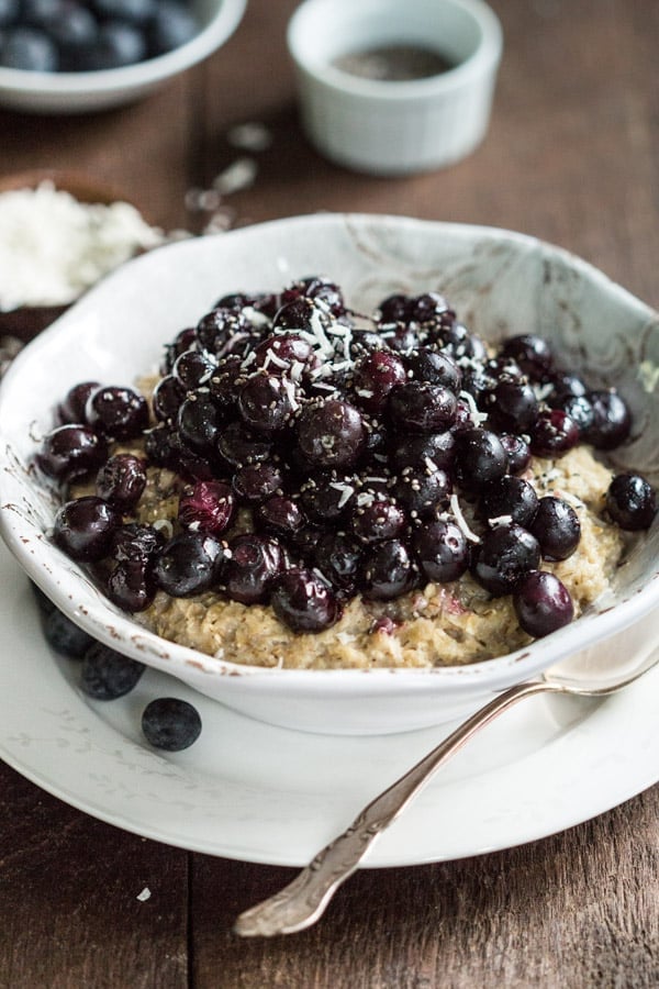 Roasted Blueberry Oatmeal - This Roasted Blueberry Oatmeal is a healthy and delicious way to start your day. It is made with coconut milk and the berries are roasted with maple syrup. 