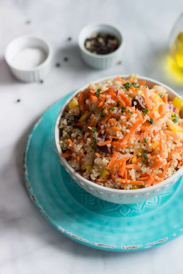 Carrot Quinoa Salad - This quinoa salad is filled with shredded carrots, red onions, bell pepper and olives. It is gluten-free, vegan, healthy and very flavourful too.