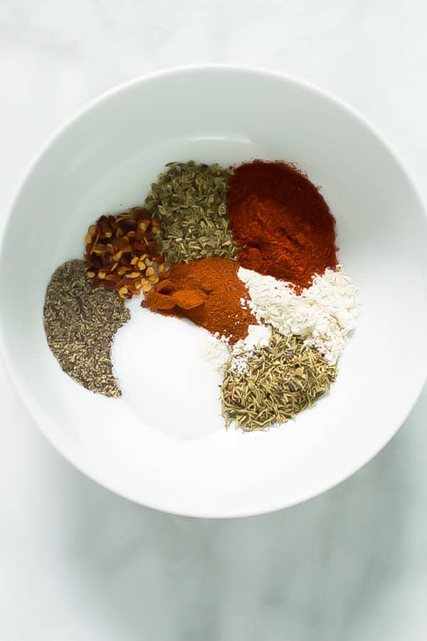 Cajun seasoning - This flavorful Cajun Seasoning recipe is made with red pepper flakes, onions, garlic and herbs. It is great with chicken, fish, shrimp and more. 