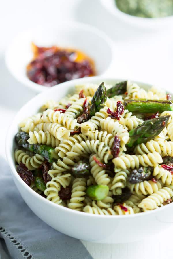 Easy asparagus pasta salad in a white bowl.