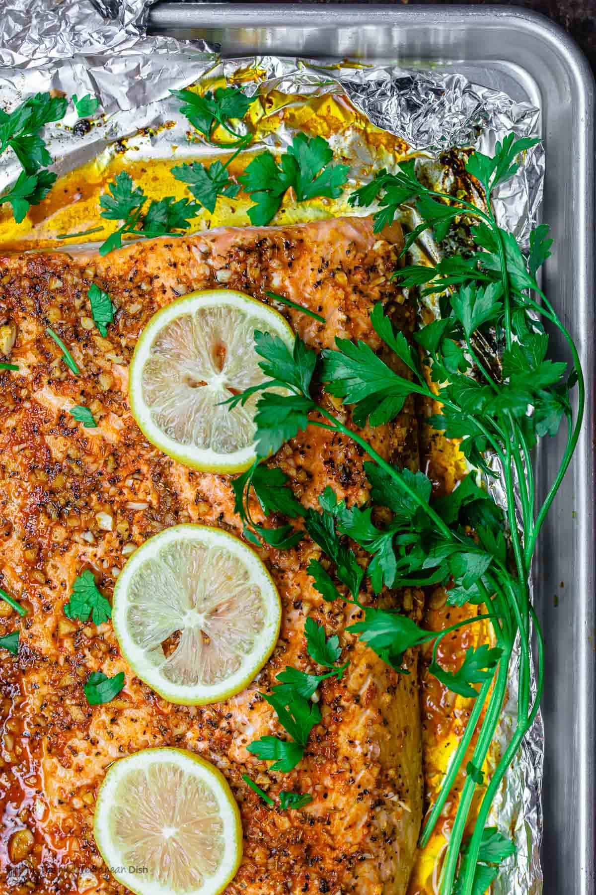 overhead view of salmon fillet in a baking sheet
