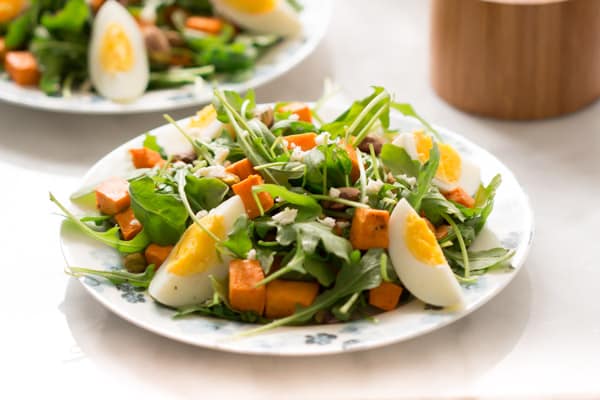 sweet-potato-arugula-salad - This Sweet Potato Arugula Salad is packed with pistachios, sweet potato, feta cheese and a delicious honey Dijon vinaigrette that pairs deliciously with arugula.