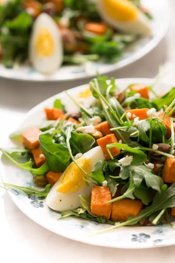 sweet-potato-arugula-salad - This Sweet Potato Arugula Salad is packed with pistachios, sweet potato, feta cheese and a delicious honey Dijon vinaigrette that pairs deliciously with arugula.