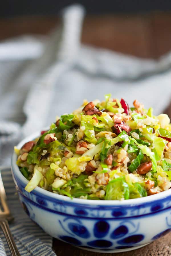 warm-quinoa-brussels-sprouts-salad-This Warm Quinoa Brussels Sprouts Salad is made with sauteé brussels sprouts, dried cranberries, chopped pecans and it's tossed with a delicious orange vinaigrette.