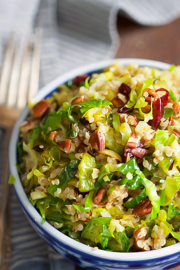 warm-quinoa-brussels-sprouts-salad-This Warm Quinoa Brussels Sprouts Salad is made with sauteé brussels sprouts, dried cranberries, chopped pecans and it's tossed with a delicious orange vinaigrette.