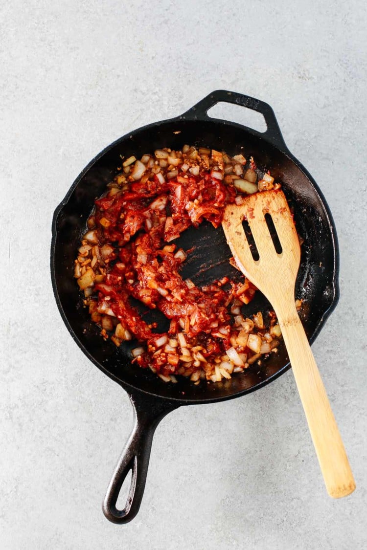 overhead view of sautéed onions in a cast iron skillet