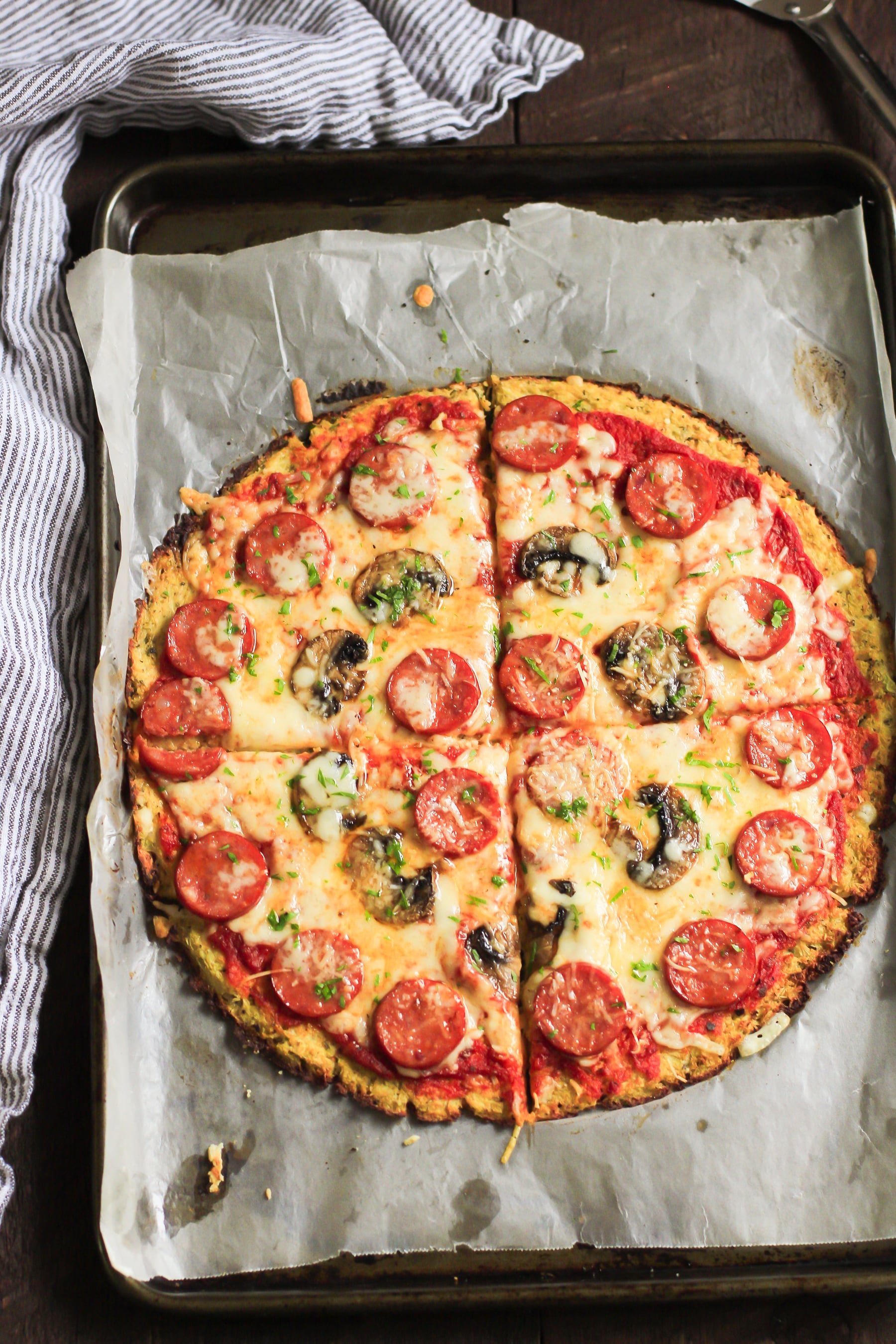 Low-carb Dinner Recipes: overhead view of cauliflower pizza crust. 