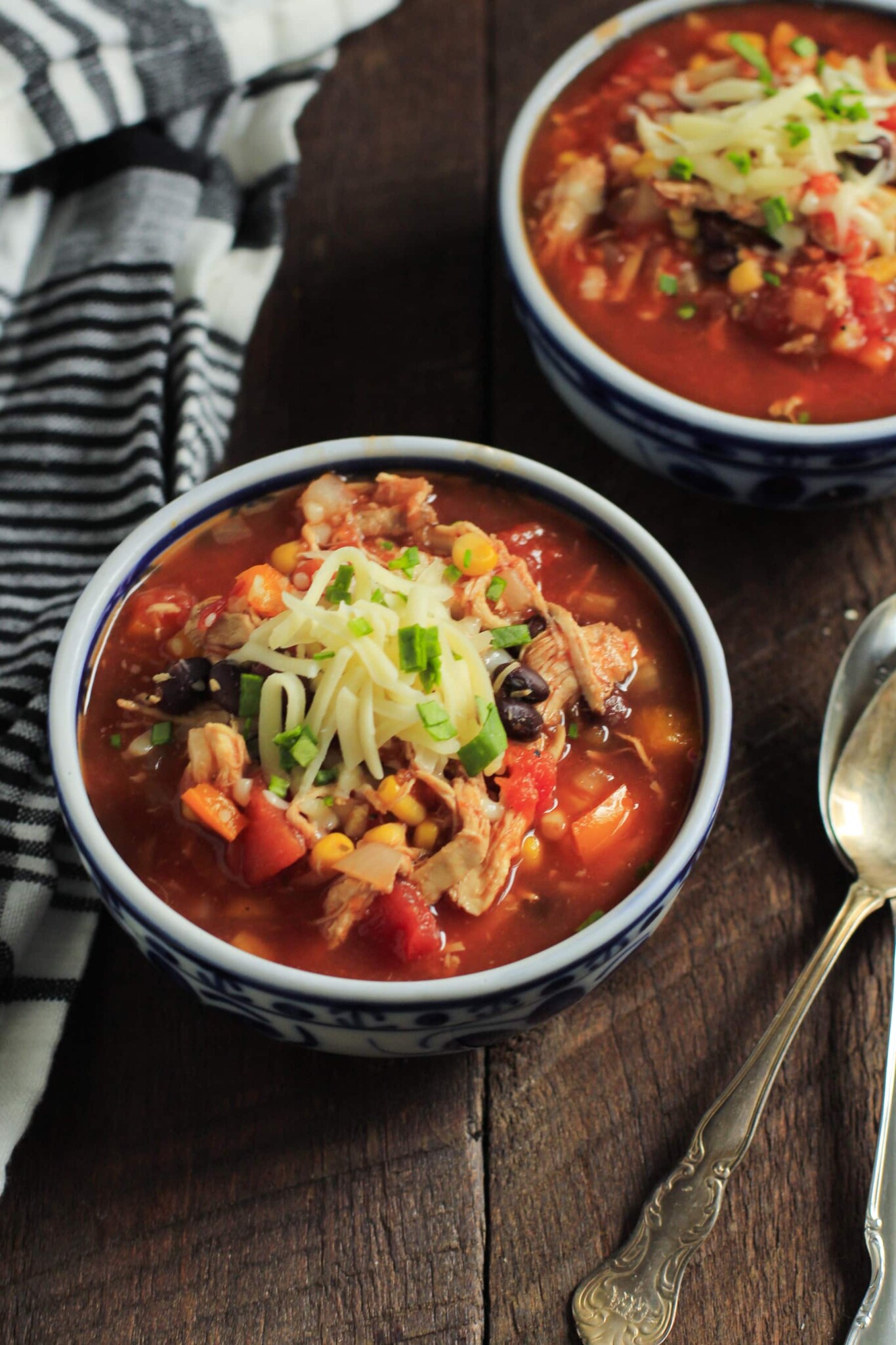 Slow cooker chicken chili in serving bowls. 