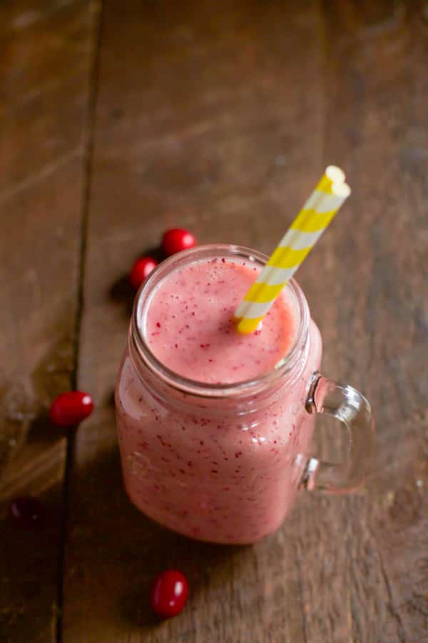 overhead view of an energy smoothie made with cranberries