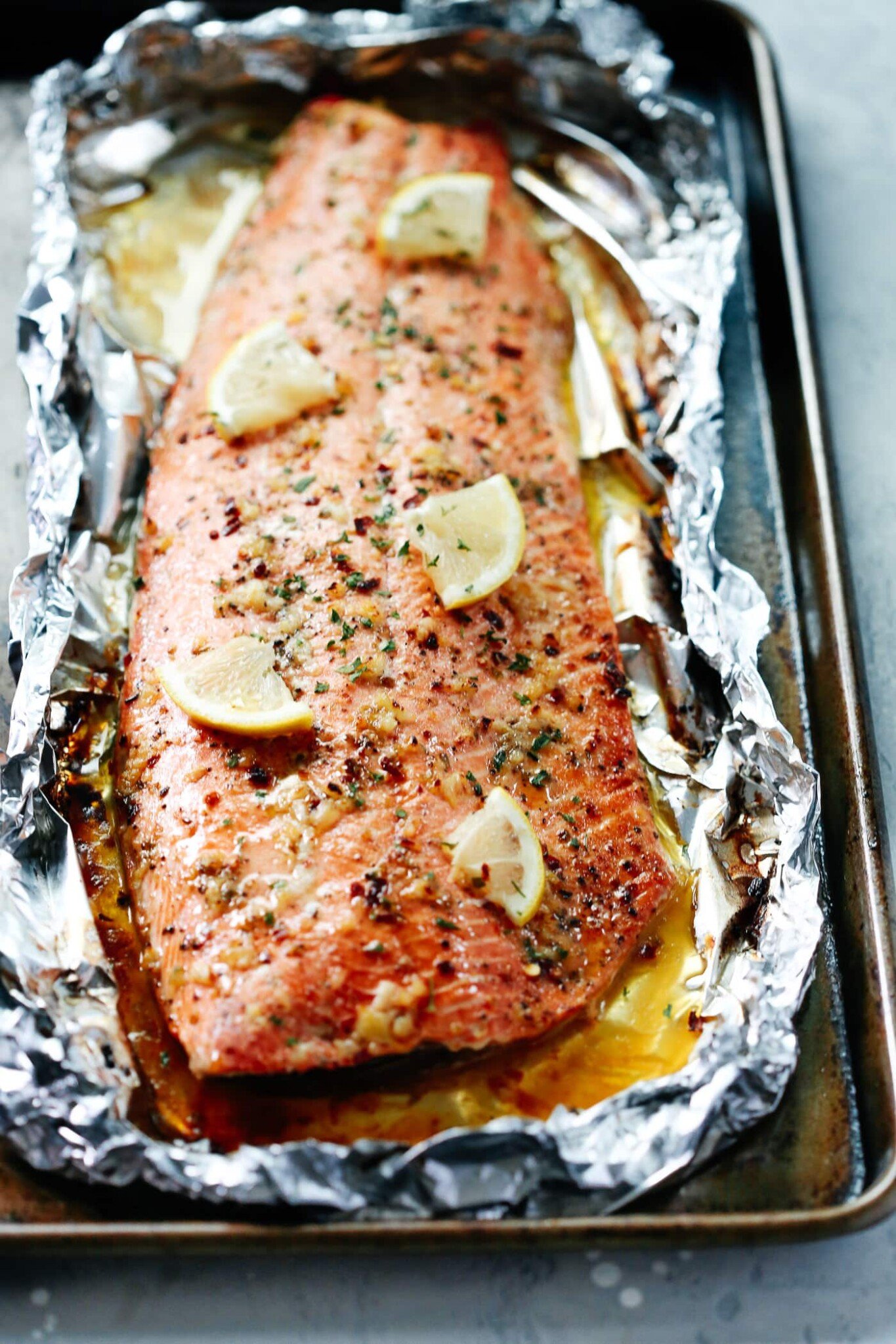 Baked Salmon Recipe with lemon slices and garlic butter 