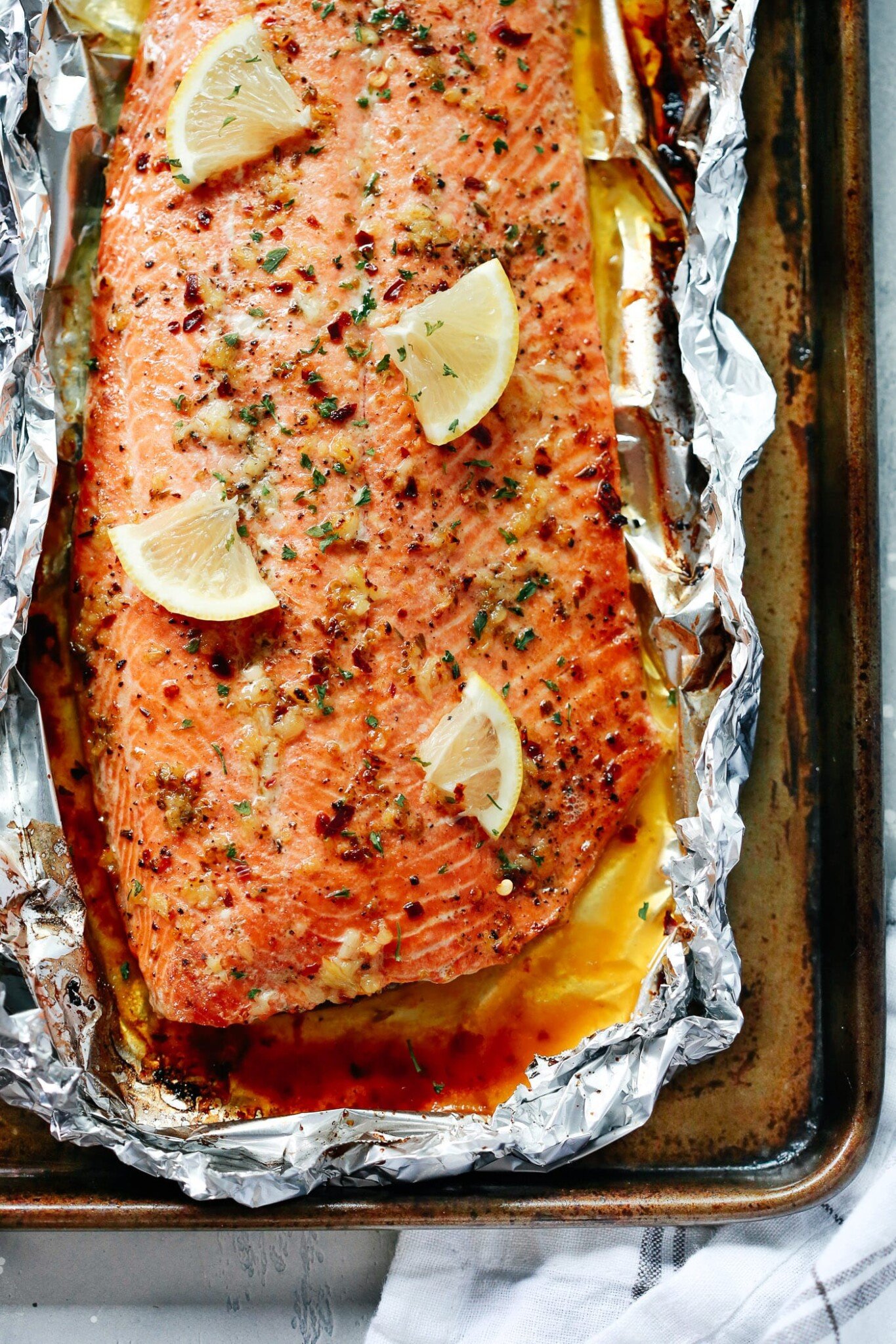 Baked Salmon Recipe with lemon slices and garlic butter