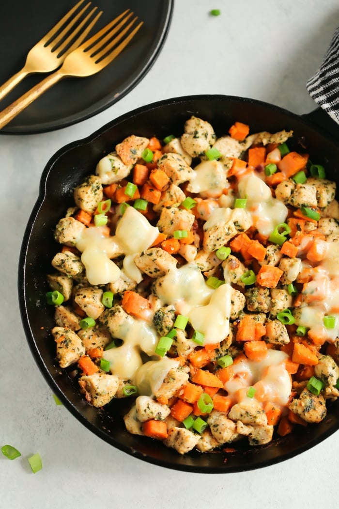 overhead view of a cast iron skillet containing Chicken and Sweet Potato