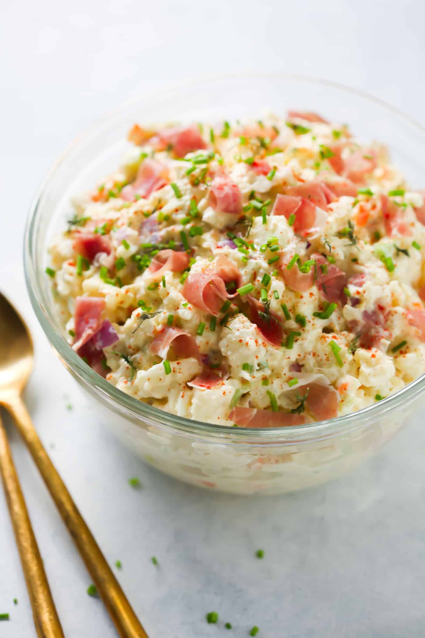 close-up of cauliflower potato salad in a glass bowl